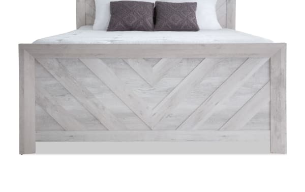 Calvin Twin White Panel Bed from Calvin Bedroom collection, transitional style with engineered wood grain, chevron design on footboard, and natural wood texture.