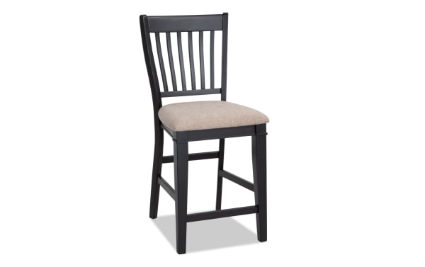 Montana Black & Beige Slat Back Upholstered Counter Height Stool with beige polyester fabric seat, black wood frame, rustic style, and memory foam cushion.