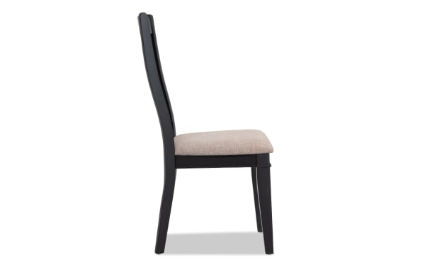 Montana Black & Beige Slat Back Upholstered Dining Chair with beige polyester fabric seat, black rubberwood frame, and rustic style from Montana Dining collection.