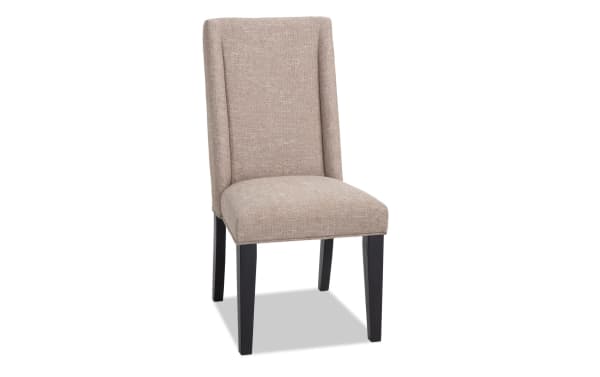 Montana Black & Beige Solid Back Upholstered Dining Chair with beige polyester fabric, black MDF legs, rustic style, and memory foam seat for comfort.