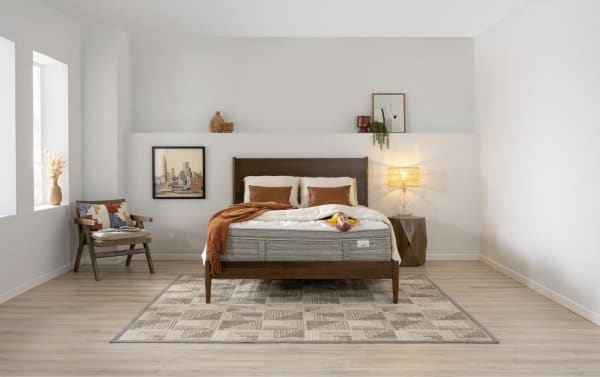 Modern bedroom with Power Bob Ultra Base and Copper Sport Hybrid 11.5'' Twin XL Firm Mattress featuring copper-infused gel memory foam, brown wooden frame, neutral bedding, and adjustable base for temperature regulation and pressure relief.