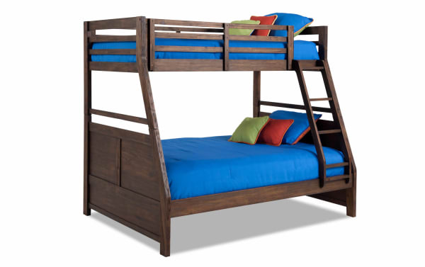 Chadwick Twin/Full Brown Bunk Bed in transitional style, made of MDF, poplar solids, and veneers, featuring a sturdy wood frame with blue bedding and ladder.