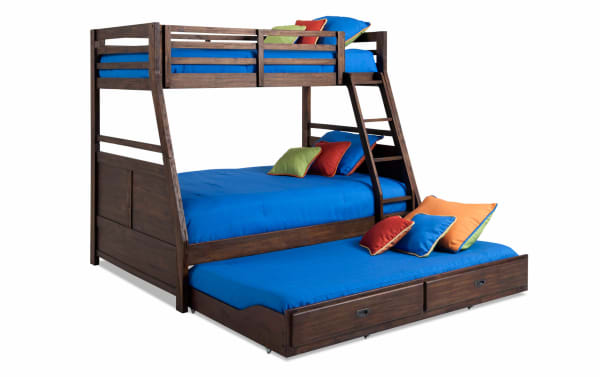 Chadwick Twin/Full Brown Bunk Bed with Twin Trundle in transitional style, made of MDF, poplar solids, and veneers, featuring dark wood finish, ladder, guardrails, and colorful pillows.