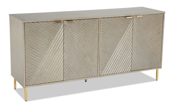 Brigitte Champagne Accent Cabinet in contemporary style with acacia veneer, reeded diagonal pattern, champagne finish, and gold legs for elegant storage.