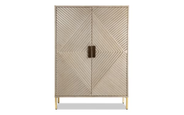 Brigitte Champagne 2 Door Bar Cabinet in contemporary style with acacia veneer and MDF, featuring a champagne finish and geometric patterned doors for stylish home bar storage.