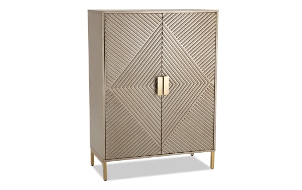 Brigitte Champagne 2 Door Bar Cabinet in contemporary style with acacia veneer and MDF, featuring geometric patterned champagne-finish doors and gold handles.