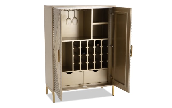 Brigitte Champagne 2 Door Bar Cabinet in contemporary style with acacia veneers and MDF, featuring champagne finish, patterned doors, wine rack, glass holder, and storage drawers.