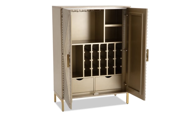 Brigitte Champagne 2 Door Bar Cabinet in contemporary style with acacia veneer and MDF, featuring champagne finish, patterned doors, wine rack, shelves, and drawers.