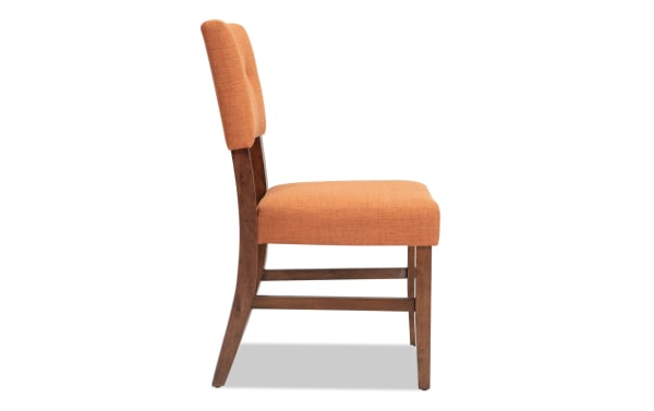 Bettie Walnut & Russet Panel Back Upholstered Dining Chair in russet orange fabric with mid-century modern curved walnut legs and button-tufted back.