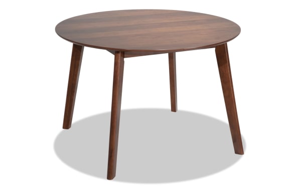 Mid-century modern Bettie Walnut Round Dining Table with flared legs, made of rubberwood solids, MDF, and walnut veneers, ideal for small rooms.