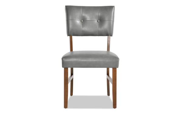 Bettie Walnut & Charcoal mid-century modern dining chair with gray faux leather upholstery, button-tufted panel back, and walnut-finished MDF legs.
