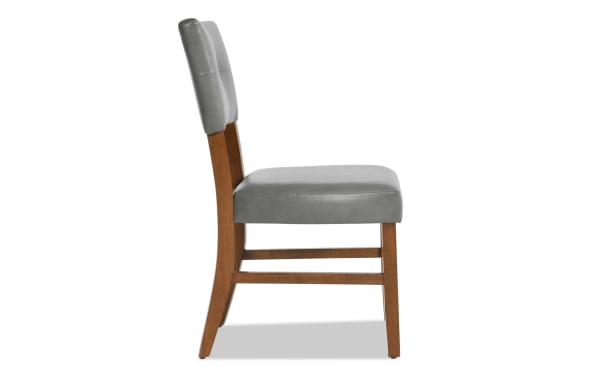 Bettie Walnut & Charcoal faux leather dining chair with mid-century modern curved walnut legs, charcoal gray upholstered panel back, and memory foam seat.