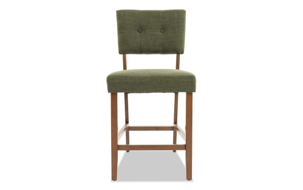 Mid-century modern Bettie Walnut & Avocado Upholstered Counter Height Stool with avocado green polyester fabric, button tufted back, and rubberwood legs.