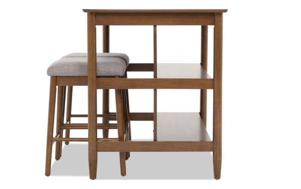 Mid-century modern wooden kitchen island with two gray upholstered bar stools, featuring open shelves for storage.