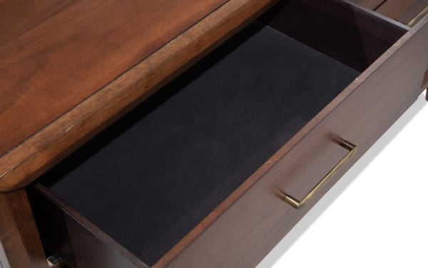 Open drawer of Bettie Brown 6 Drawer Dresser in mid-century modern style, showing walnut veneer finish, black felt lining, and brass hardware.