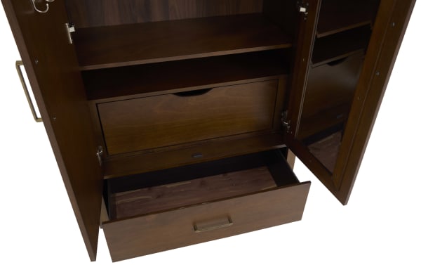 Dark wood storage cabinet with open doors showing interior shelves, a pull-out drawer, and a door-mounted mirror, featuring brass handles and hinges.