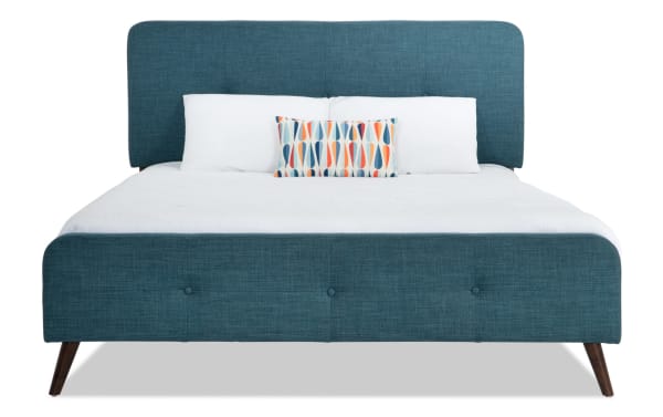 Bettie Twin Teal Upholstered Platform Bed with polyester fabric, mid-century modern style, button tufting, and flared wooden legs in blue.