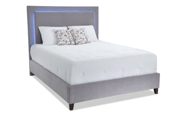 Performa Queen Gray Upholstered Panel Bed with plush polyester fabric, rubberwood frame, and built-in LED lighting in contemporary Performa Bedroom collection.