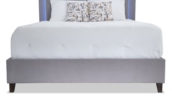 Performa Queen Gray Upholstered Panel Bed with plush polyester fabric, rubberwood frame, and contemporary LED-lit headboard from Performa Bedroom collection.
