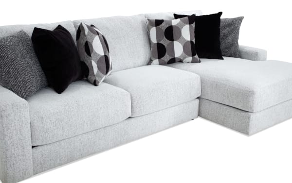 Mason White 123'' 2 Piece Right Arm Facing Chaise Sectional in white polyester fabric with six black and patterned accent pillows, transitional style.