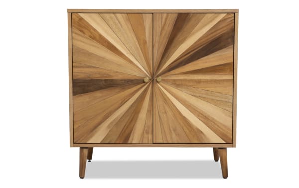 Starburst Natural 2 Door Cabinet in contemporary style with MDF and acacia veneers, featuring a sunburst pattern in natural wood tones and brass knobs.