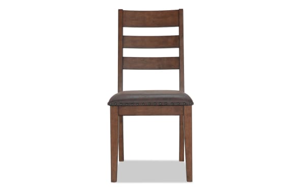 Canyon Brown Faux Leather Ladder Back Upholstered Dining Chair with rustic MDF wood frame, brown faux leather seat, and nailhead trim.