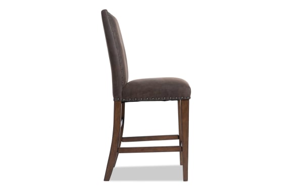 Canyon Brown faux leather solid back counter height stool with nailhead trim, memory foam seat, rustic style, and MDF frame from Canyon Dining collection.