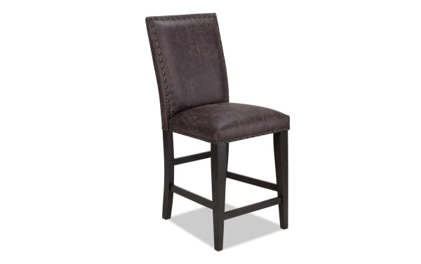 Canyon Gray faux leather counter height stool with solid back, rustic style, MDF frame, memory foam seat, and nailhead trim from Canyon Dining collection.