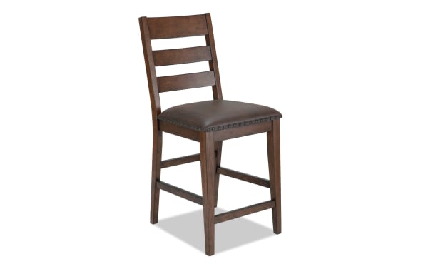 Canyon Brown Faux Leather Ladder Back Counter Height Stool with rustic brown MDF frame, faux leather seat upholstery, and memory foam cushion from Canyon Dining collection.