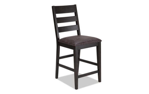 Canyon Gray Faux Leather Ladder Back Counter Height Stool with rustic MDF frame, gray faux leather upholstery, and memory foam seat from Canyon Dining collection.