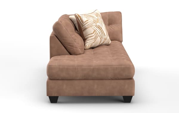 Modern brown suede chaise lounge with tufted seat and back cushions, angled backrest, and decorative beige and gold patterned throw pillows.