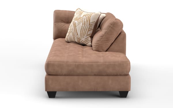 Modern brown leather chaise lounge with tufted seat, angled backrest, and two decorative pillows on black tapered legs, ideal for living rooms.
