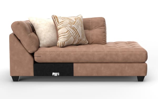 Modern brown suede chaise lounge sofa with tufted cushions, angled backrest, and two decorative throw pillows in beige and patterned fabric.