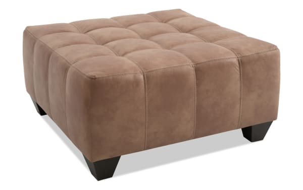 Square Sierra Cognac Ottoman in brown polyester fabric with tufted top, black tapered legs, transitional style, and memory foam cushioning for seating or footrest.