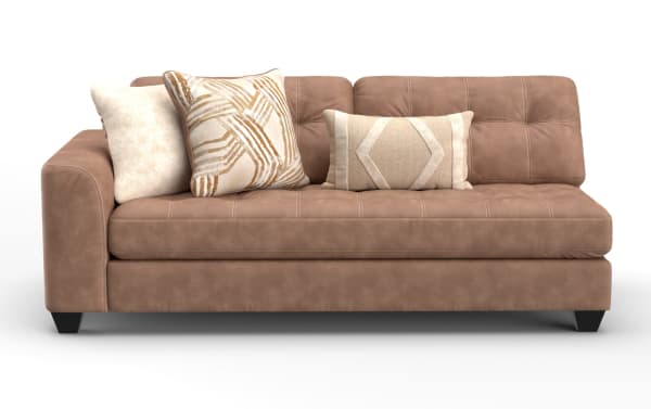 Brown leather sectional sofa with tufted cushions, featuring three decorative beige and patterned throw pillows, modern design with short black legs.