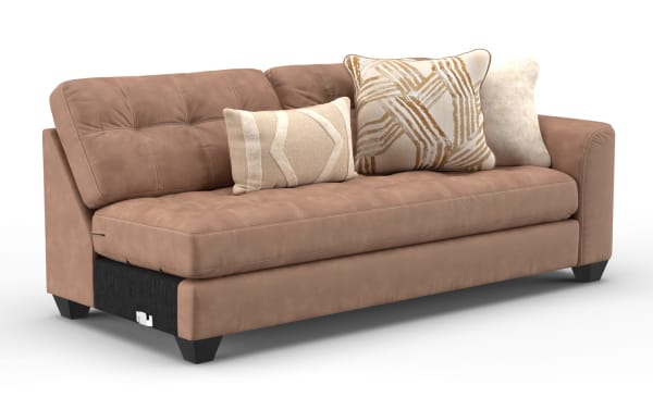Modern brown leather sofa with tufted cushions, angled armrests, and three decorative beige and patterned throw pillows, ideal for living room decor.