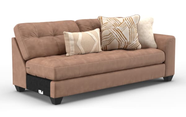 Modern brown leather sofa with tufted cushions, angled armrests, and three decorative beige and patterned throw pillows, ideal for contemporary living rooms.