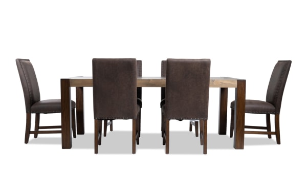 Canyon 7 Piece Brown Faux Leather Upholstered Dining Set with rustic multi-tone MDF wood table and memory foam seating, brown faux leather chairs.
