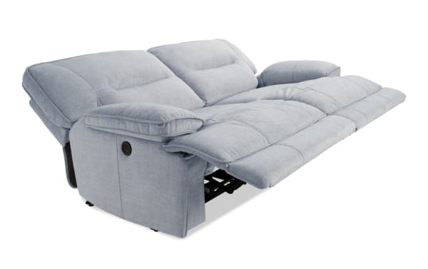 Silver Pacifica 82" power reclining loveseat in transitional style, upholstered in soft polyester fabric with memory foam cushions and USB charging port.