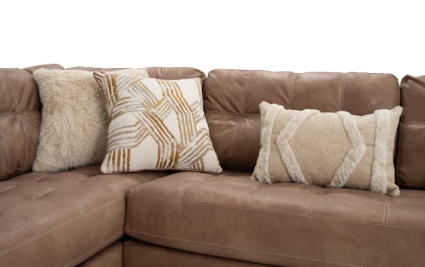 Sierra Cognac 118'' 2 Piece Left Arm Facing Chaise Sectional with tufted cognac brown polyester fabric, transitional style, and decorative beige accent pillows.