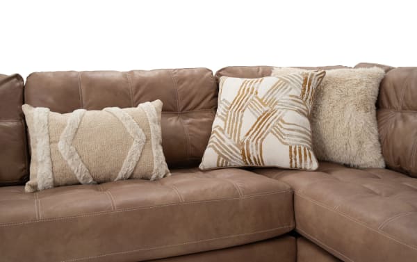 Sierra Cognac 118'' 2-piece right arm facing chaise sectional with tufted cognac brown polyester and polyurethane fabric, featuring textured and patterned beige accent pillows in transitional style.