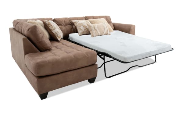 Sierra Cognac 118" 2-piece left arm facing sleeper chaise sectional in brown polyester fabric with tufted cushions, accent pillows, and full gel memory foam mattress.