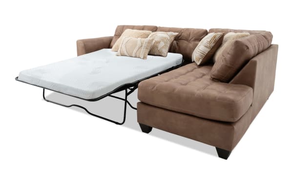 Sierra Cognac 118'' 2 Piece Right Arm Facing Transitional Sleeper Chaise Sectional with tufted polyester fabric, accent pillows, and full gel memory foam mattress.