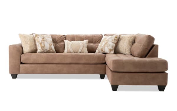 Sierra Cognac 118" 2-piece right arm facing sleeper chaise sectional in brown polyester fabric, transitional style with tufted cushions and accent pillows.