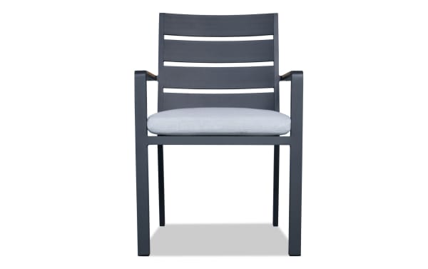 Contemporary Laguna Gray Aluminum Outdoor Dining Side Chair with light gray polyester fabric cushion, weather-resistant powder-coated frame, and slatted back.