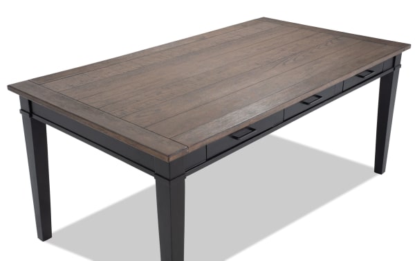 Montana Black & Brown Storage Dining Table with rustic oak veneer top, black rubberwood legs, and six storage drawers for dining room organization.