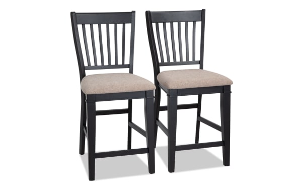 Montana Dining rustic counter height stools set of 2 with beige polyester fabric upholstery, black slat back, and memory foam seat cushion.