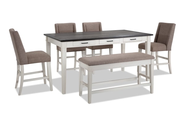 Montana 6 Piece Rustic Counter Height Dining Set with beige polyester upholstered chairs and storage bench, white rubberwood base, oak veneer top, and six storage drawers.