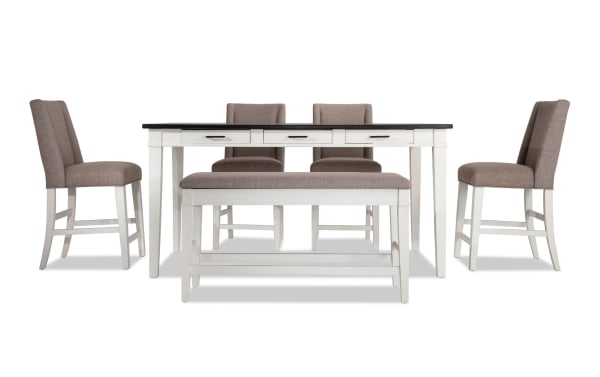 Montana 6 Piece Rustic Counter Height Dining Set with beige polyester fabric upholstery, rubberwood and oak veneer distressed top, white base, 4 chairs, and storage bench with memory foam seat.
