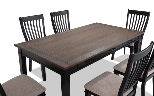 Montana 7 Piece Black & Beige Upholstered Dining Set with rustic rubberwood and oak veneer table, six storage drawers, and beige polyester fabric chairs with memory foam.